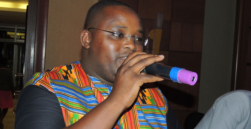 African Queens Marketing Manager Bruce Kariisa Muhame talking to the guests